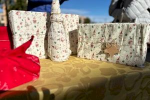 Los campelleros aprenden la técnica japonesa de envolver regalos con tela